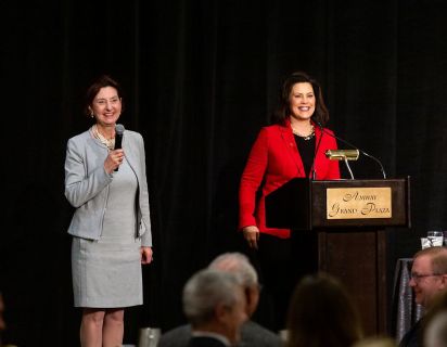 Birgit Klohs and Governor Gretchen Whitmer on stage