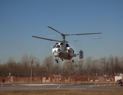 Military helicopter landing on navy ship