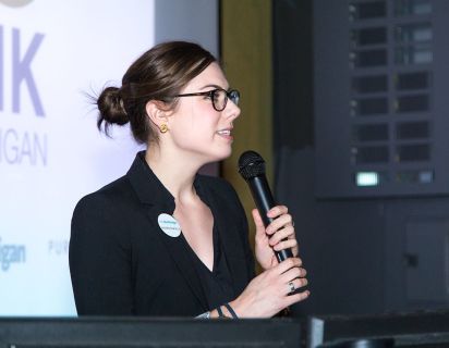 Woman Speaking on Stage
