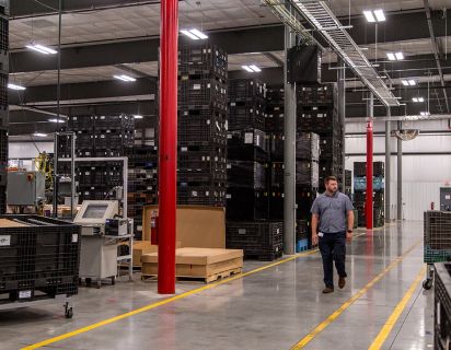 Man walking through production plant